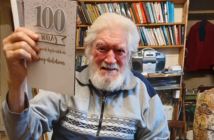 Man with 100 today card